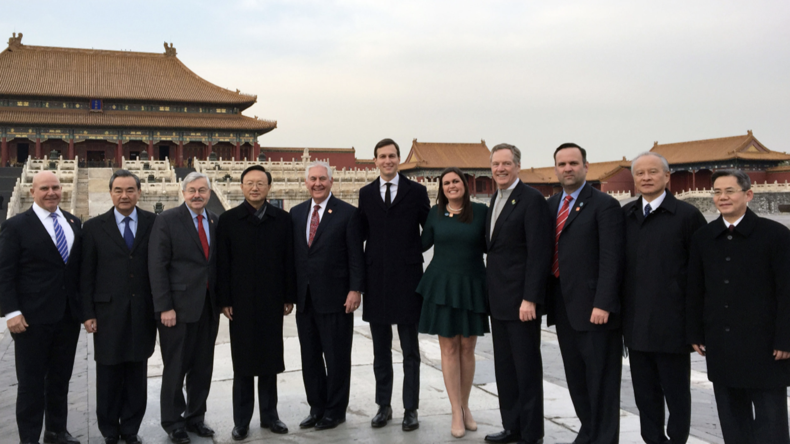 Senior U.S. and Chinese government officials pose for a photo in front of buildings in the Forbidden City, Beijing.