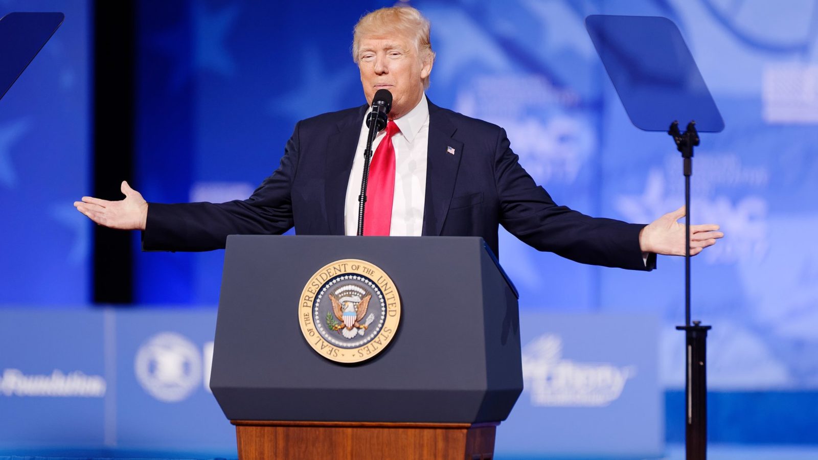 US President Donald Trump speaks at a podium