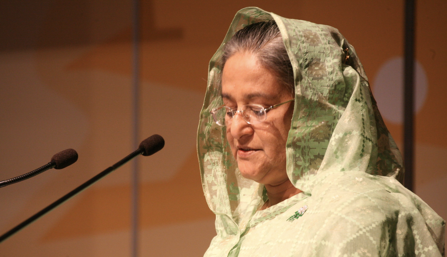 Prime Minister Sheikh Hasina speaks into a microphone
