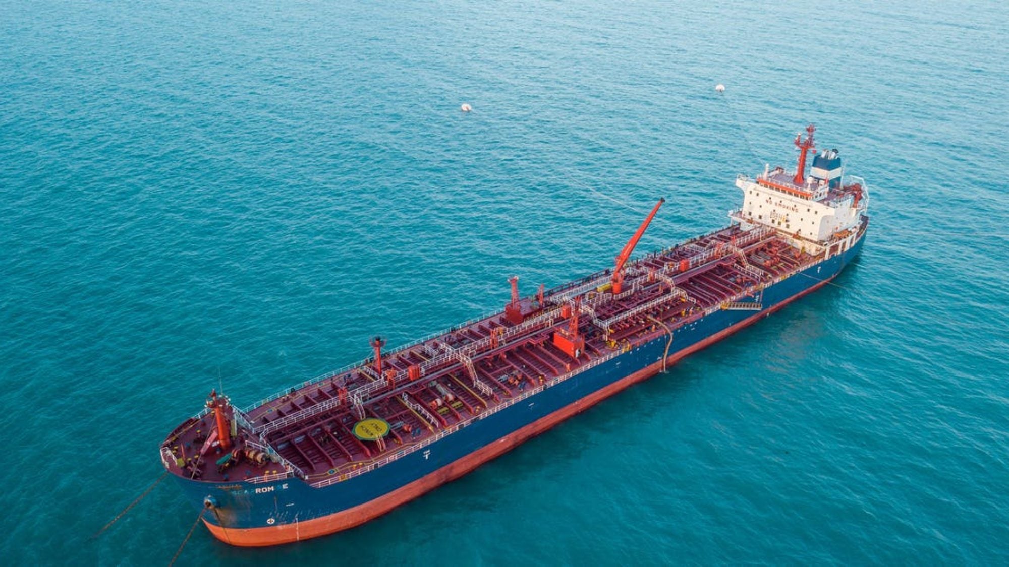 Large shipping vessel in turquoise waters