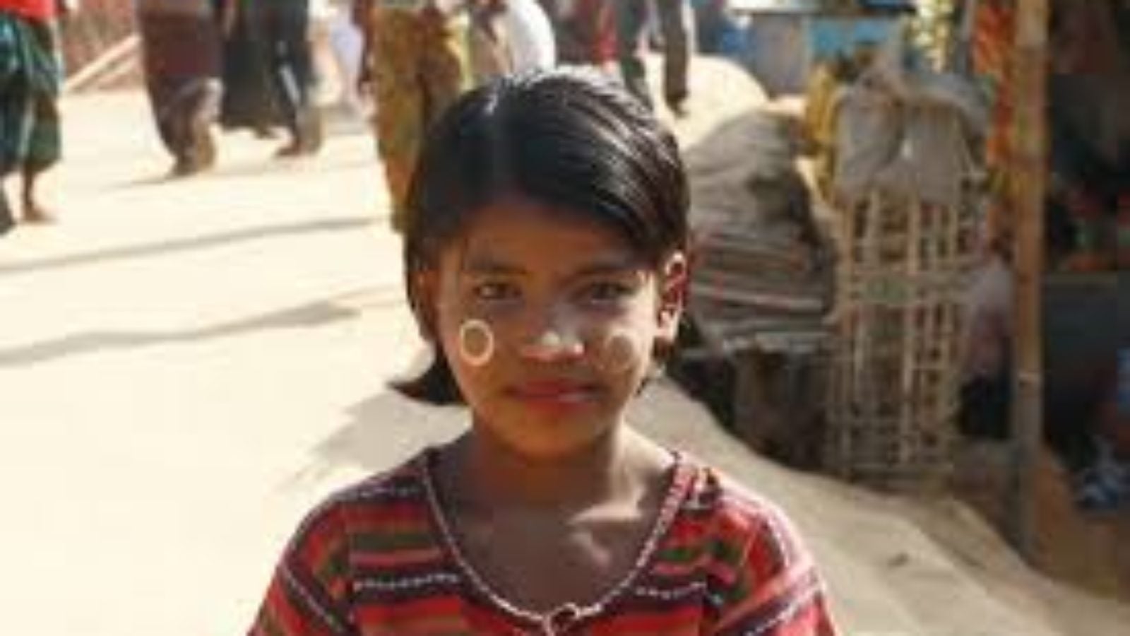 Rohingyan girl stands on the street