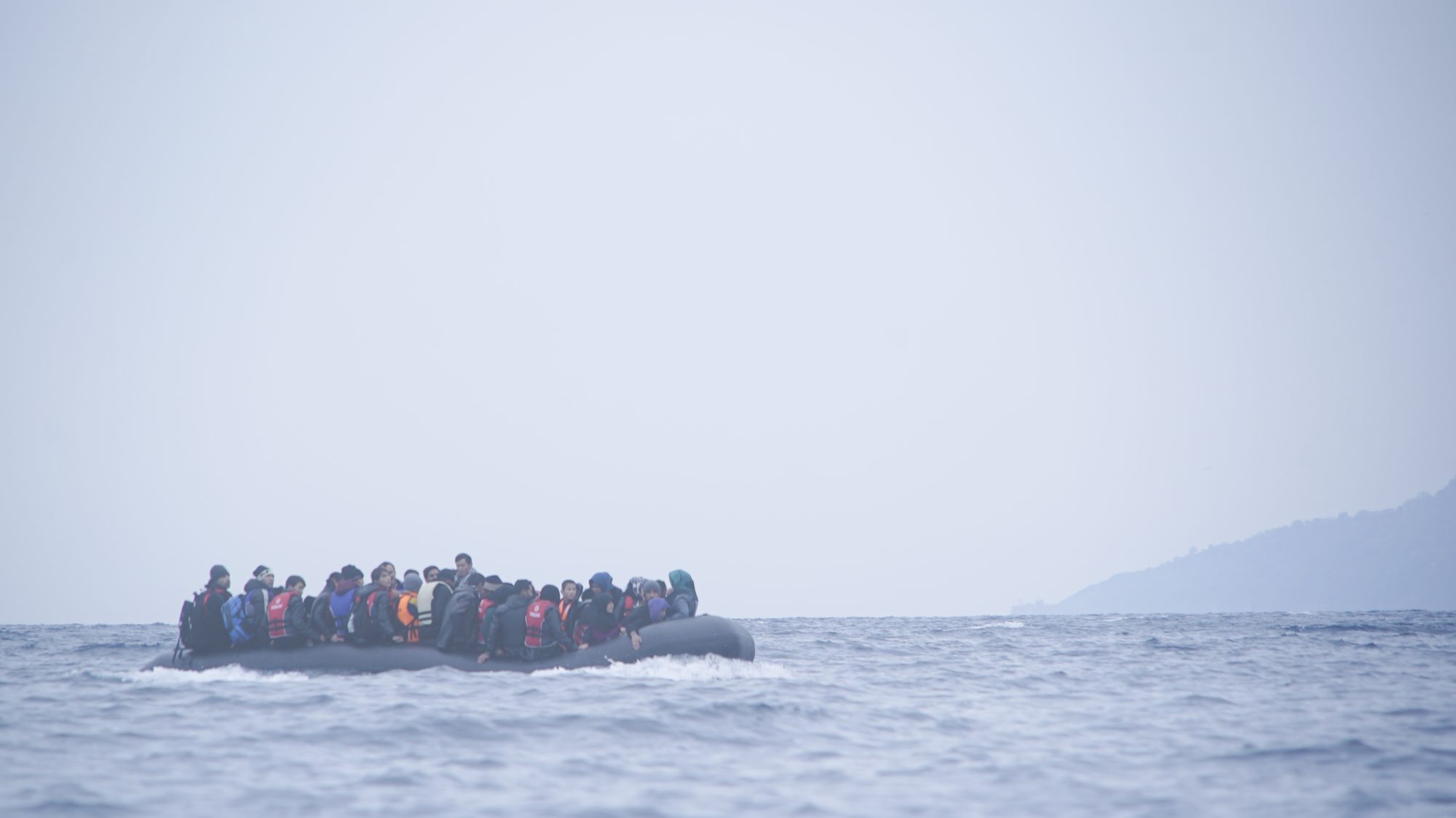 Refugees_on_a_boat_crossing_the_Mediterranean_sea,_heading_from_Turkish_coast_to_the_northeastern_Greek_island_of_Lesbos,_29_January_2016