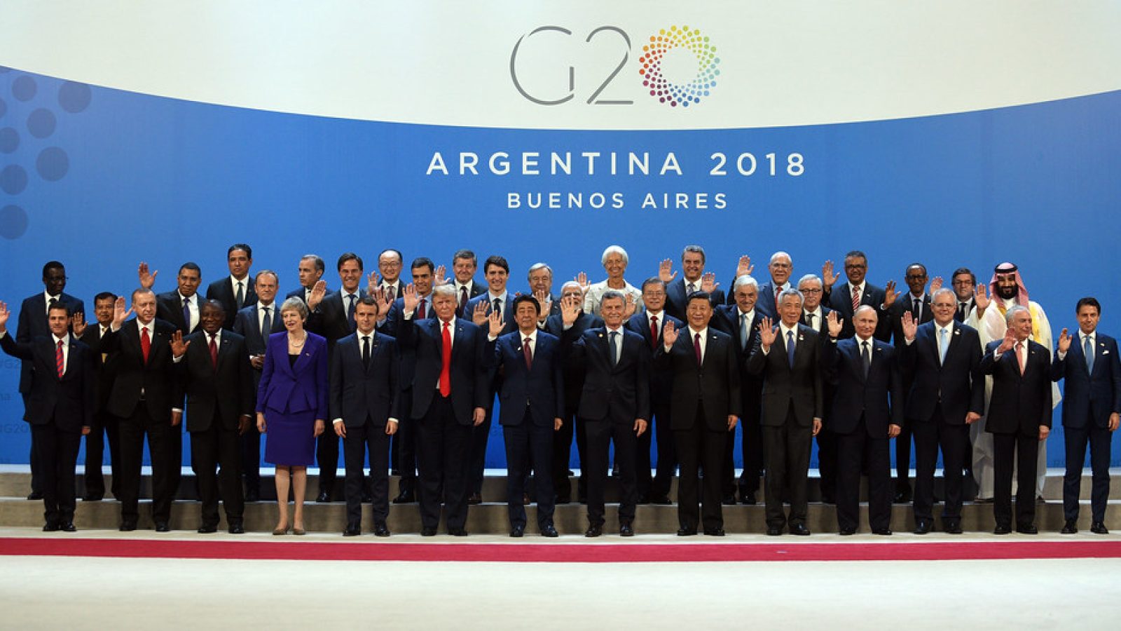 world leaders stand together at the G20 conference