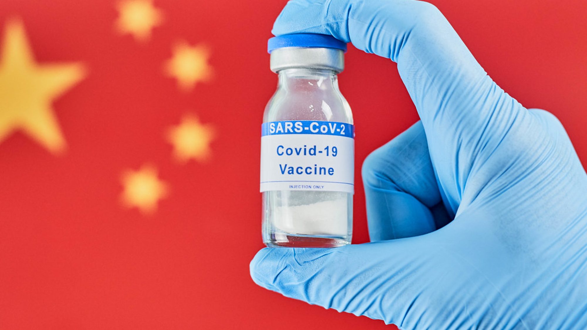 COVID-19 Vaccine with Chinese Flag in the Background