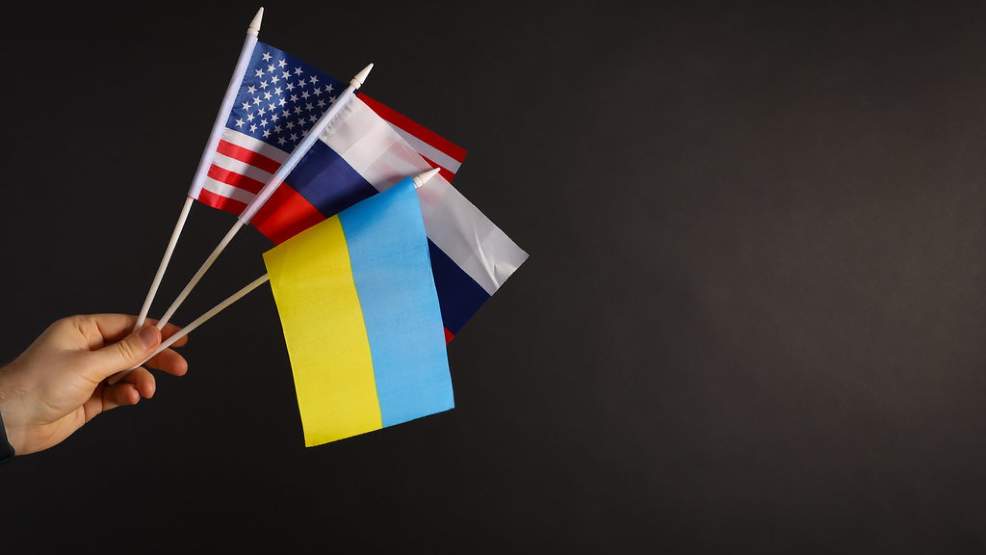 American, Russian, and Ukrainian flags