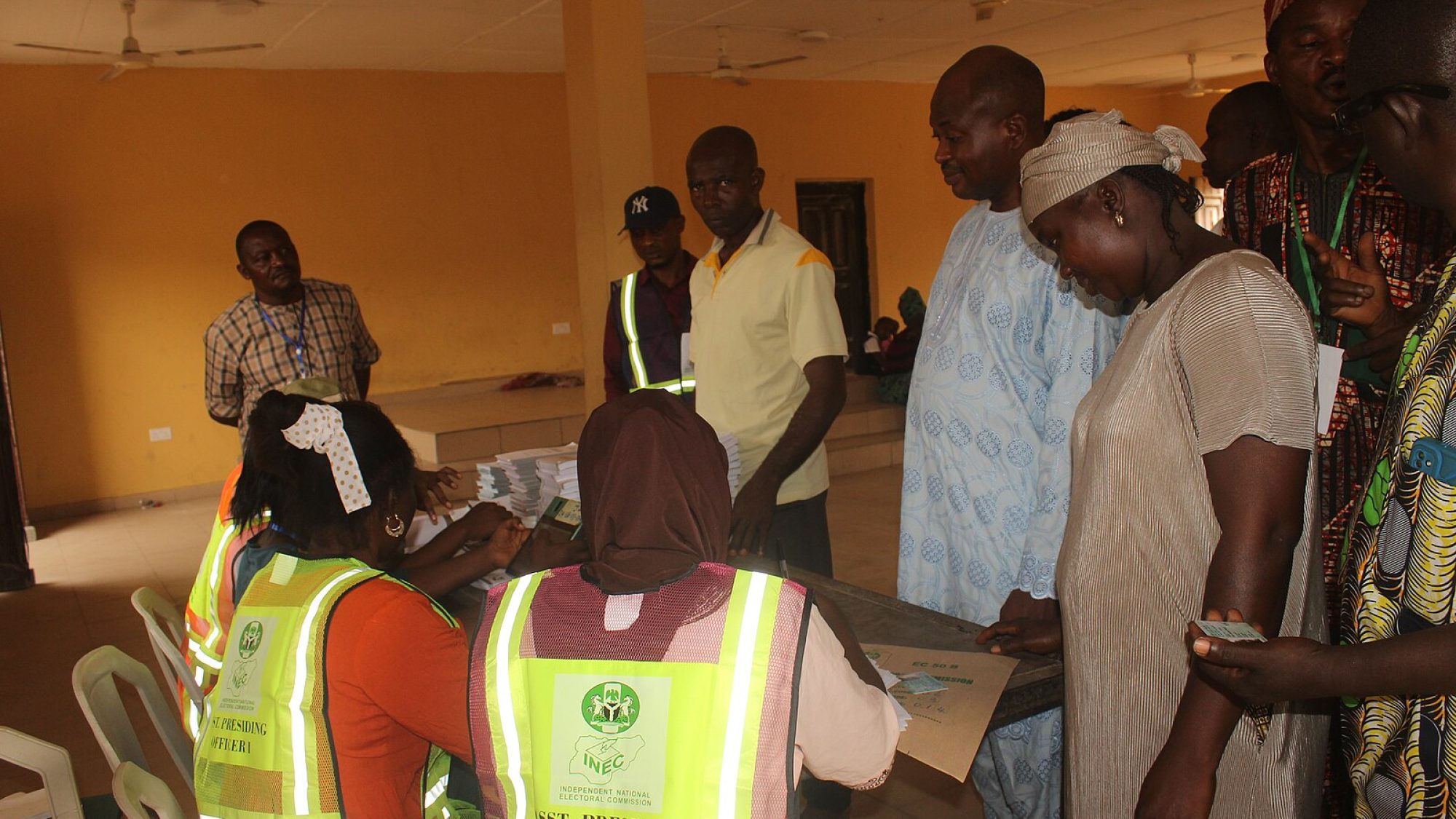 Elections workers and voters at a booth in Nigeria
