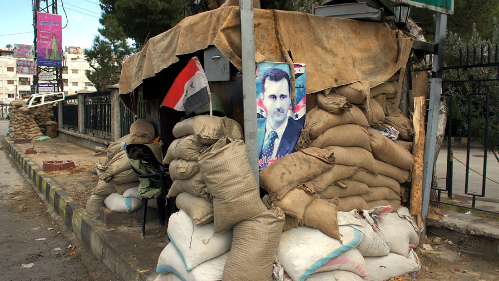 Poster of Syrian President Bashar al-Assad placed at a checkpoint in Damascus.