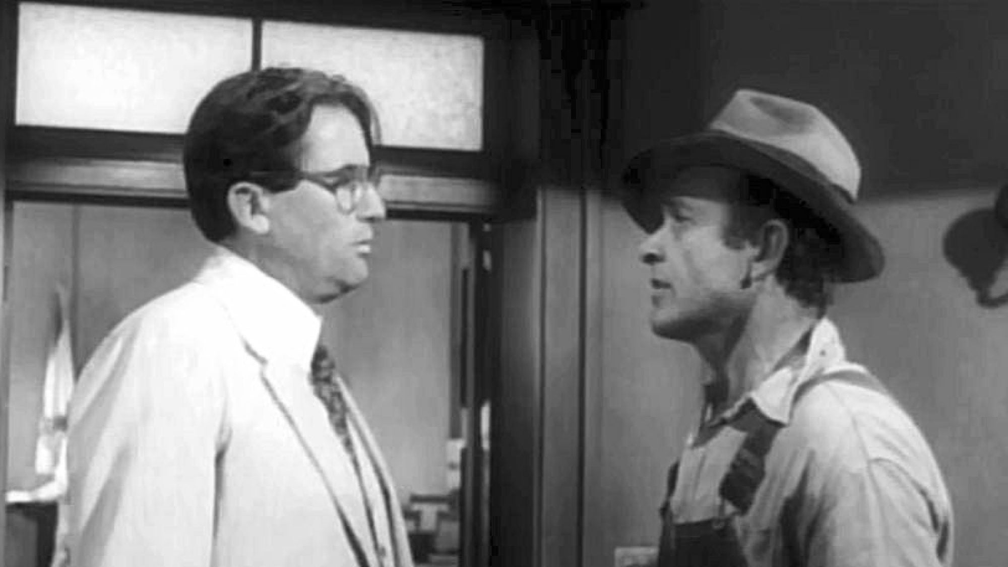 Scene from the film To Kill a Mockingbird (1962) with Atticus Finch (played by Gregory Peck) and Tom Robinson (played by Brock Peters).