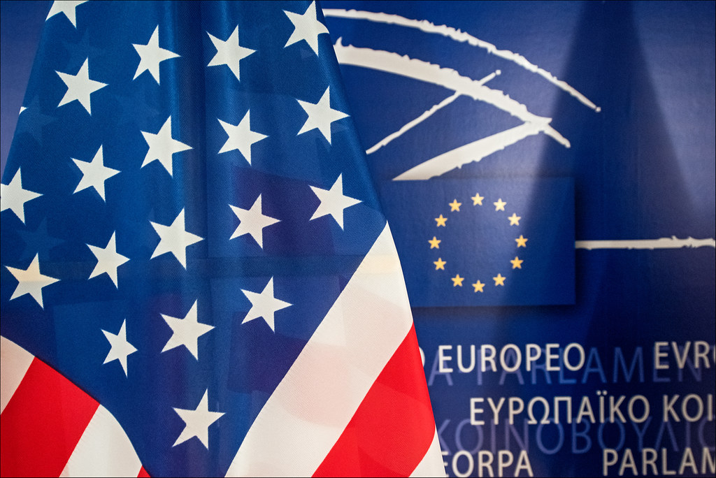 American flag next to European Union background