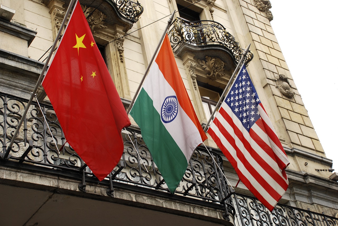 From left to right: the flag of China, India, and the United States