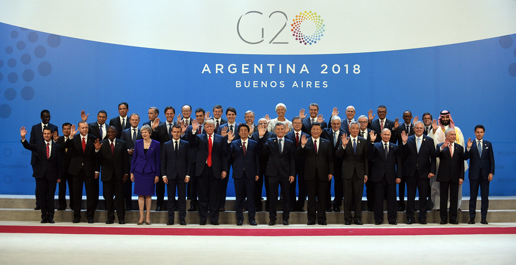 world leaders stand together at the G20 conference