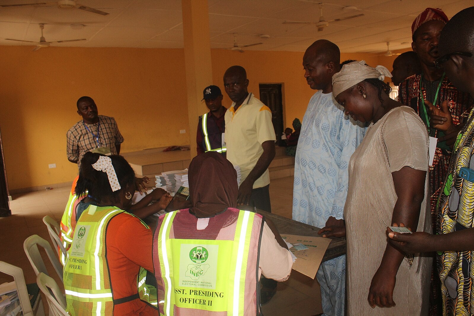 Elections workers and voters at a booth in Nigeria